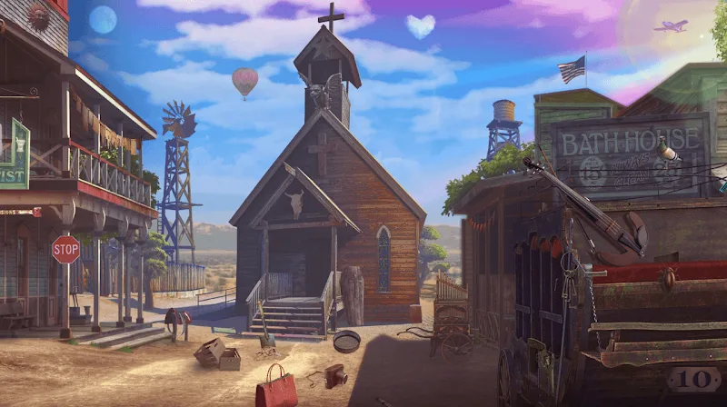 Spielszene aus Wild West: Hidden Object Games — die Hauptstraße einer Westernstadt mit Holzkirche, Windrad, Badehaus und einem Planwagen im Staub